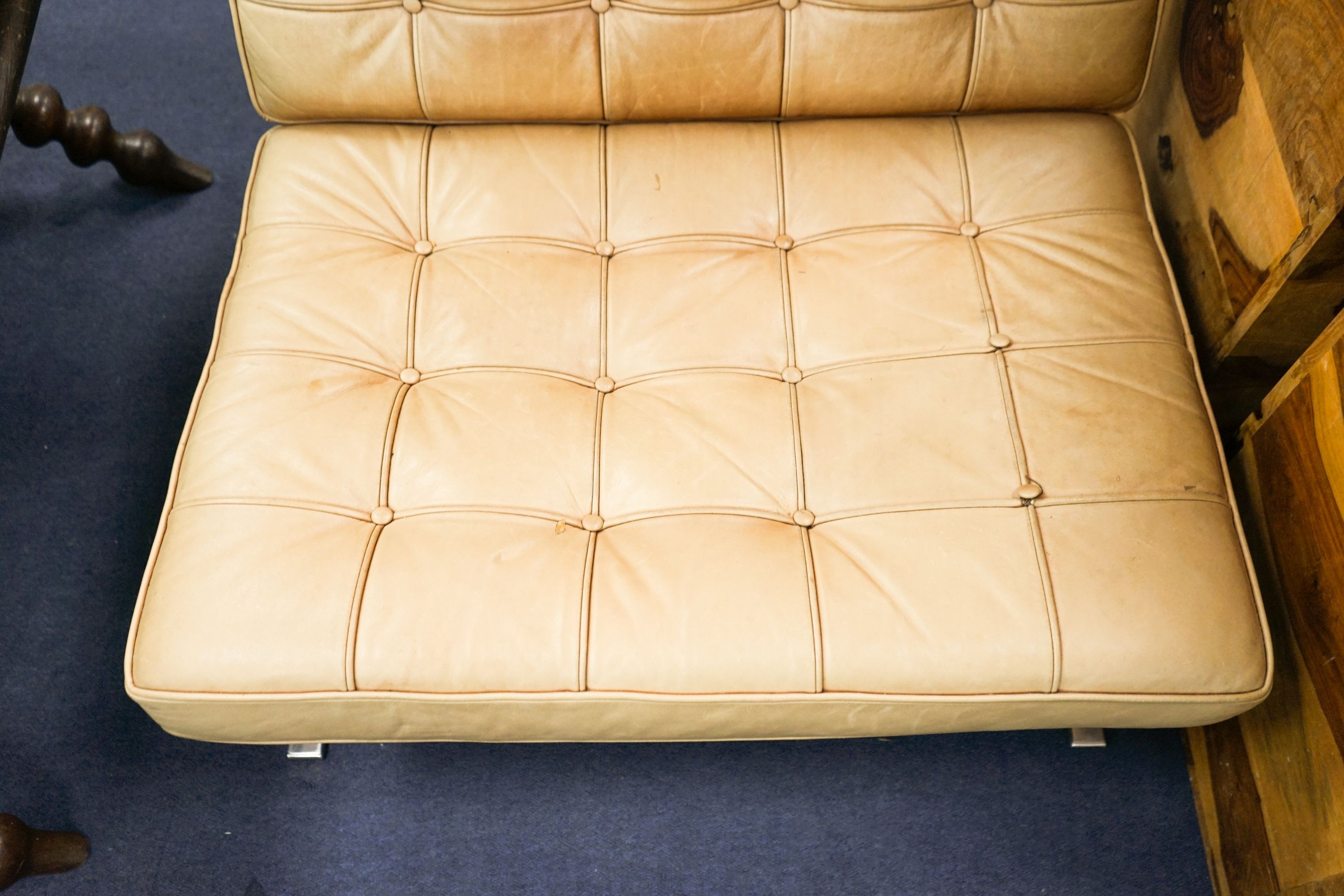 A brown leather and chrome Barcelona type chair, width 76cm, depth 70cm, height 74cm